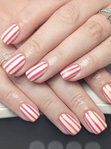 Short nails in pink and cream candy stripes